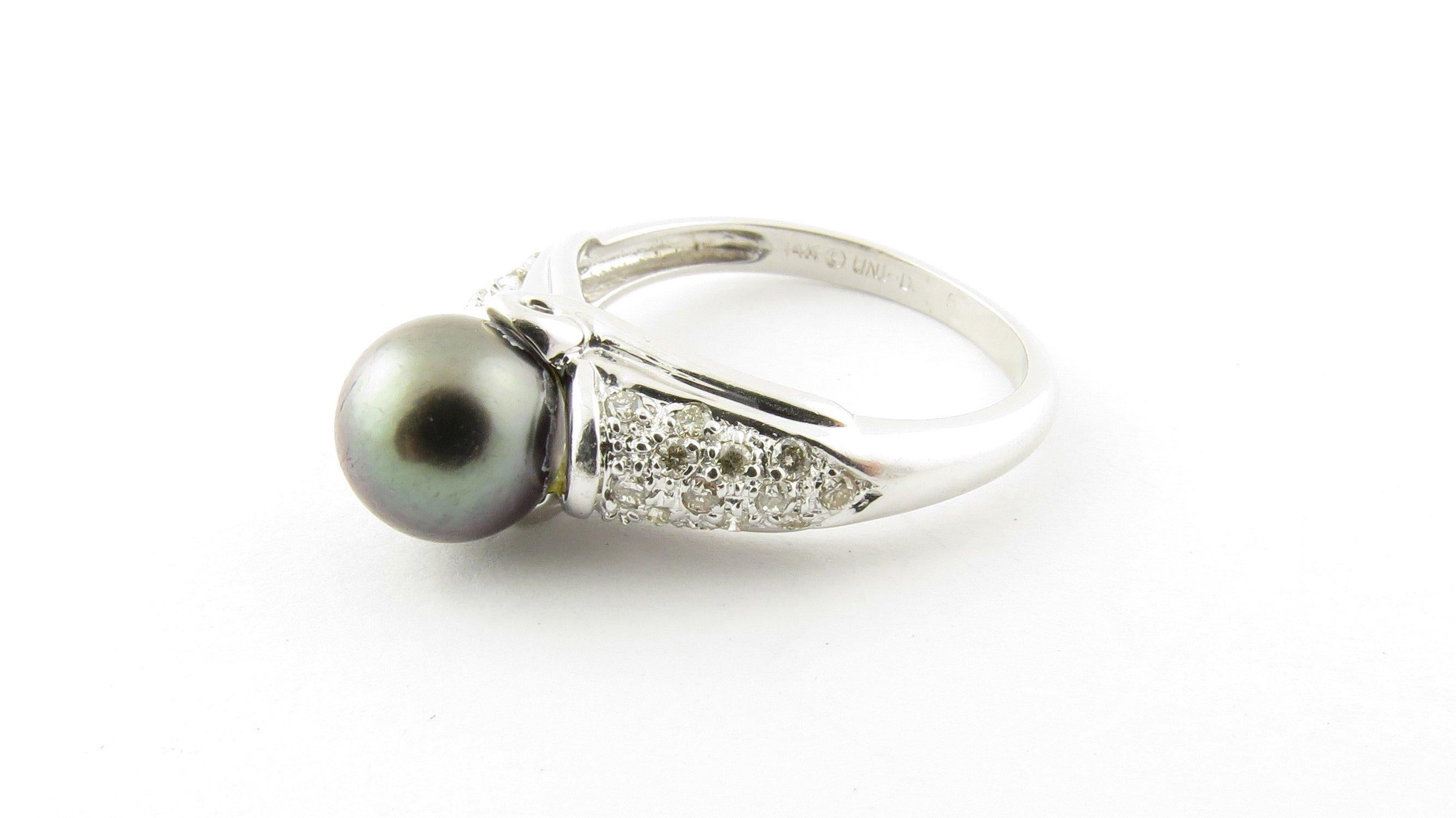 Vintage 14 Karat White Gold Black Pearl and Diamond Ring Size 6.75- This stunning ring features one 9 mm black pearl accented with 28 round brilliant cut diamonds set in beautifully detailed 14K white gold. Shank measures 2 mm. Approximate total
