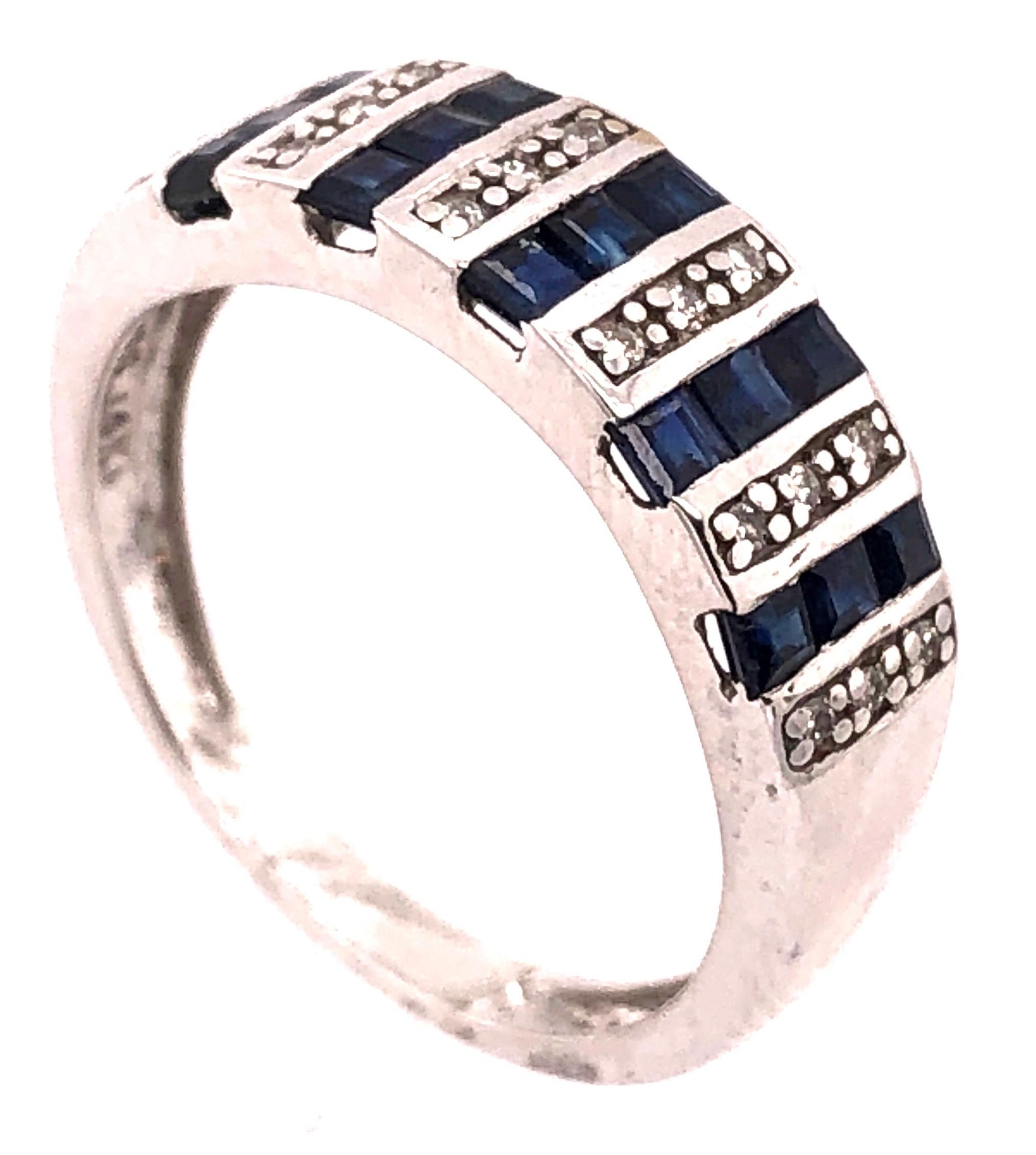 Modern 14 Karat White Gold Blue Sapphire and Diamond Band Ring 0.18 TDW For Sale