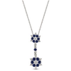14 Karat White Gold, Blue Sapphire, and Diamond Flowers Pendant for Necklace