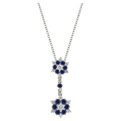 14 Karat White Gold, Blue Sapphire, and Diamond Flowers Pendant for Necklace