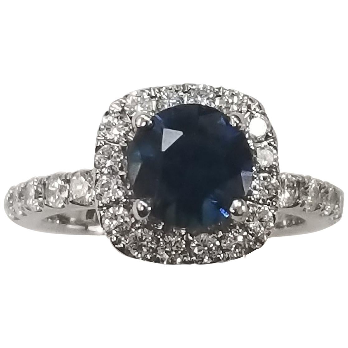 14 Karat White Gold Blue Sapphire and Diamond Halo Ring