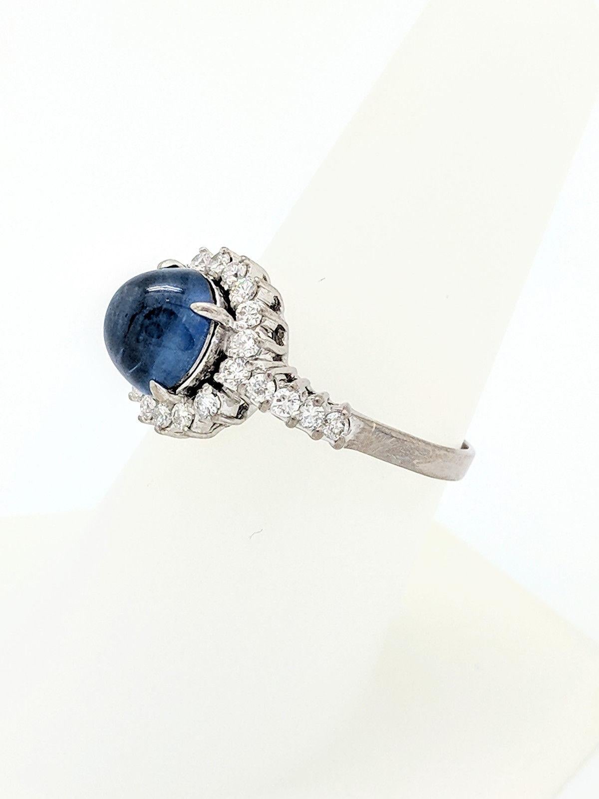 Women's 14 Karat White Gold Blue Star Sapphire and Diamond Halo Ring