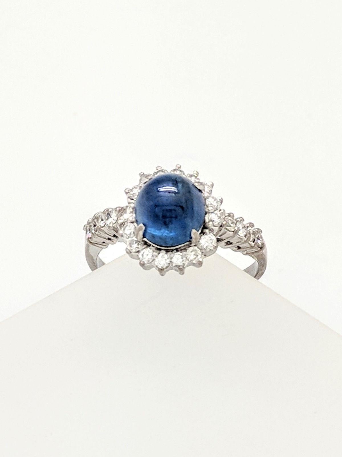 14 Karat White Gold Blue Star Sapphire and Diamond Halo Ring 1