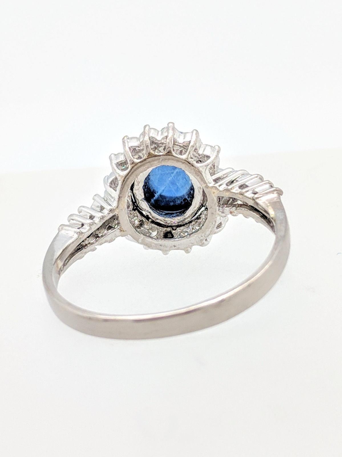 14 Karat White Gold Blue Star Sapphire and Diamond Halo Ring 3