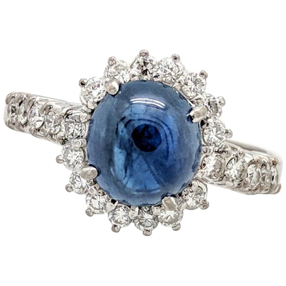 14 Karat White Gold Blue Star Sapphire and Diamond Halo Ring