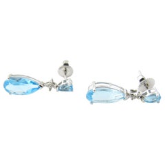 14 Karat White Gold Blue Topaz and Diamond Earrings