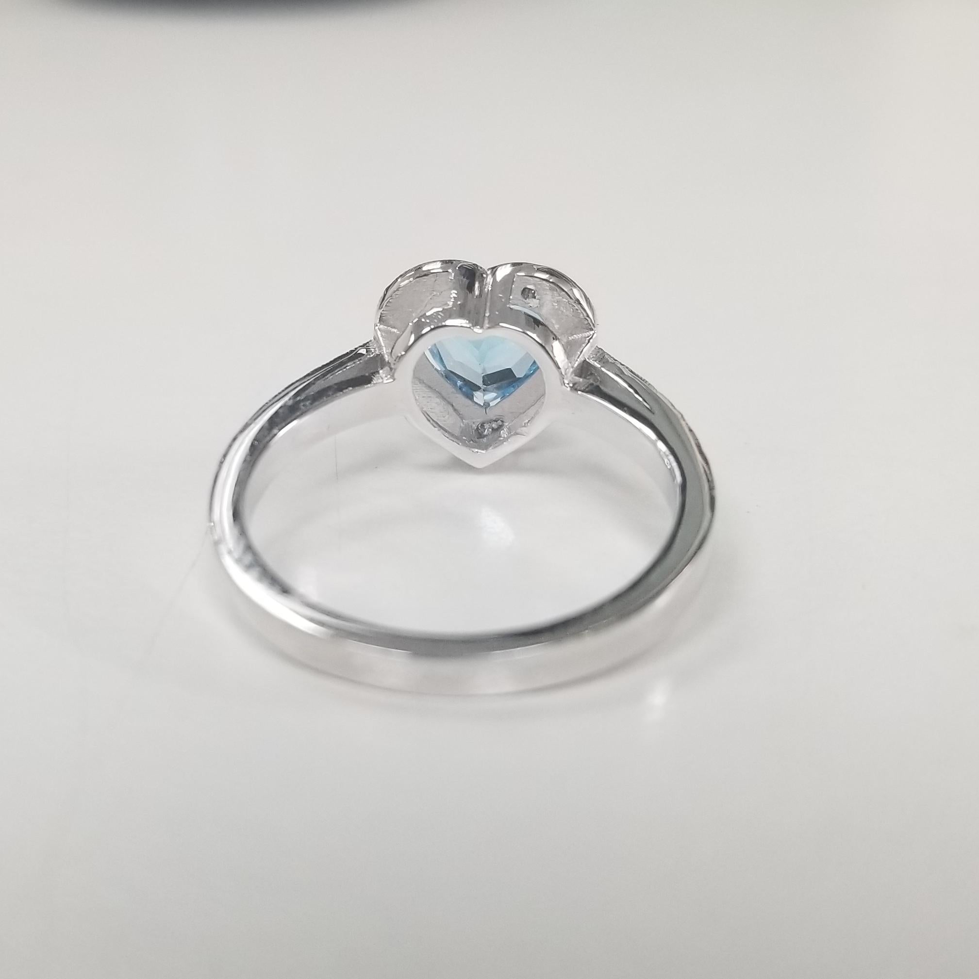 Contemporary 14 Karat White Gold Blue Topaz and Diamond Heart Halo Ring For Sale