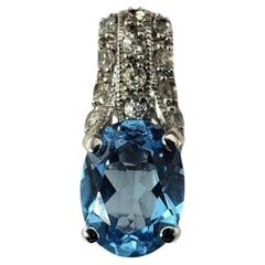 14 Karat White Gold Blue Topaz and Diamond Pendant #18636
