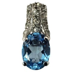 14 Karat White Gold Blue Topaz and Diamond Pendant #18636