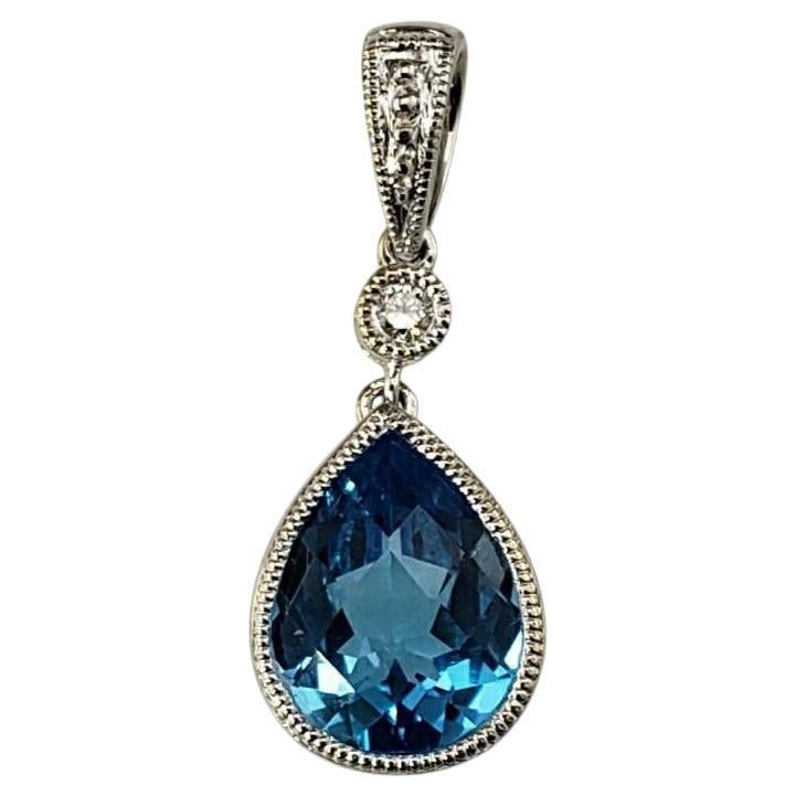 14 Karat White Gold Blue Topaz and Diamond Pendant #20361