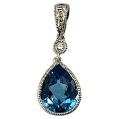 14 Karat White Gold Blue Topaz and Diamond Pendant #20361