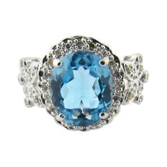 14 Karat White Gold Blue Topaz and Diamond Ring