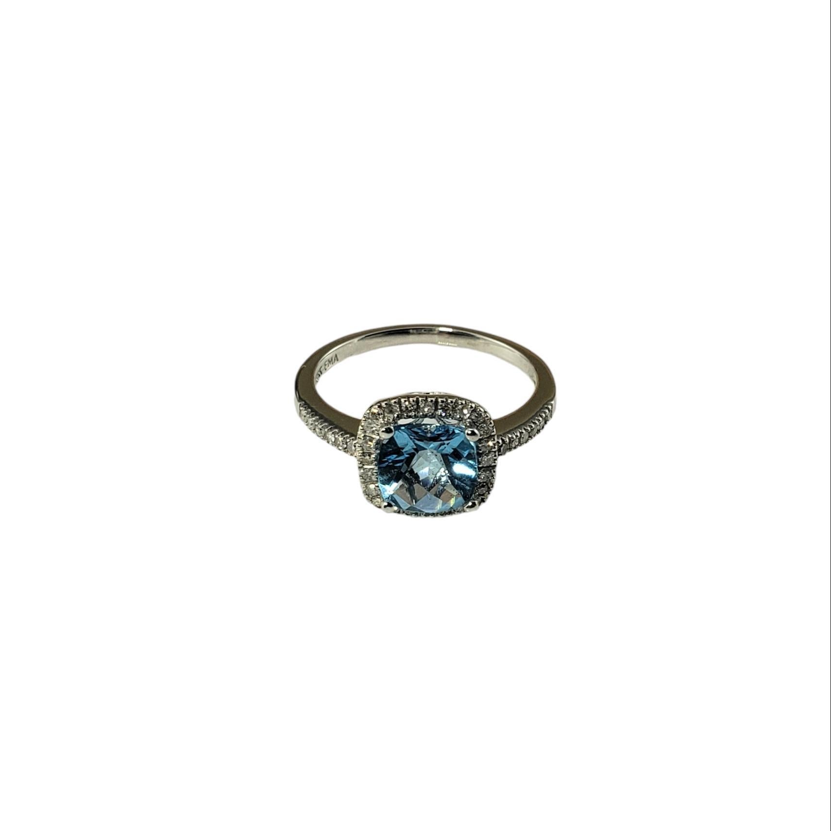 Vintage 14 Karat White Gold Blue Topaz and Diamond Ring Size 6.25-

This elegant ring features one blue topaz (7 mm x 7 mm) surrounded by 36 round single cut diamonds set in classic 14K white gold.  Width: 10 mm.  
Shank: 1.5 mm.

Approximate total