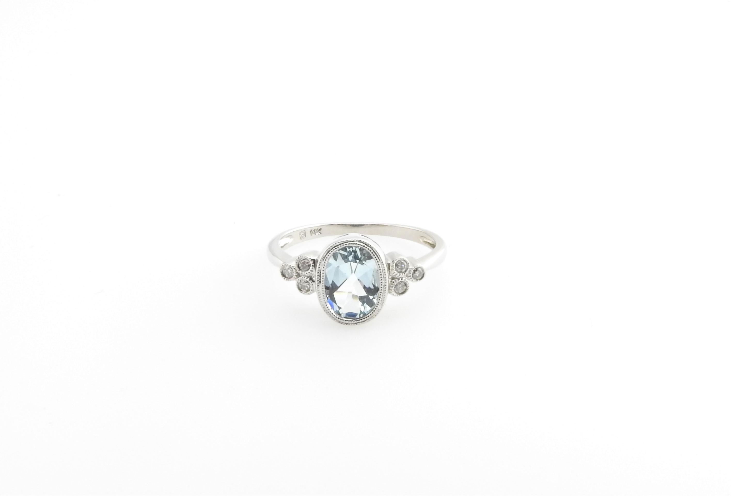 Vintage 14 Karat White Gold Blue Topaz and Diamond Ring Size 7.25

This lovely ring features one oval blue topaz 8 mm x 6 mm and six round brilliant cut diamonds set in beautifully detailed 14K white gold. Shank: 1.5 mm.

Approximate total diamond