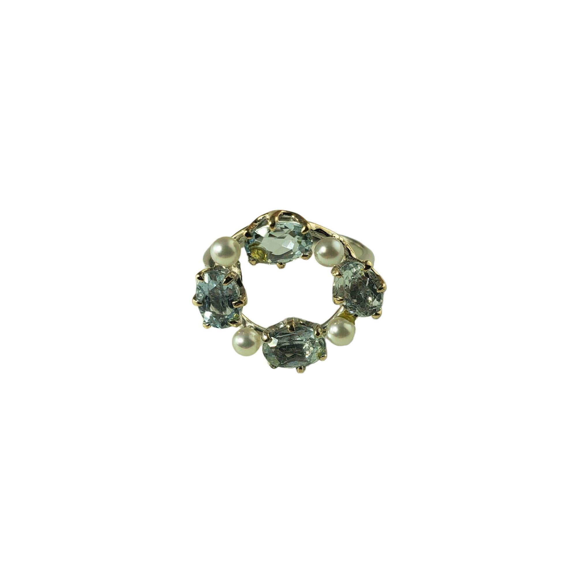 Vintage 14 Karat White Gold Topaz and Diamond Ring Size 3.25 JAGi Certified-

This elegant ring features four oval blue topaz stones and four white cultured pearls set in classic 14K white gold.  Width:  15 mm.

Shank:  1 mm.

Total topaz weight: