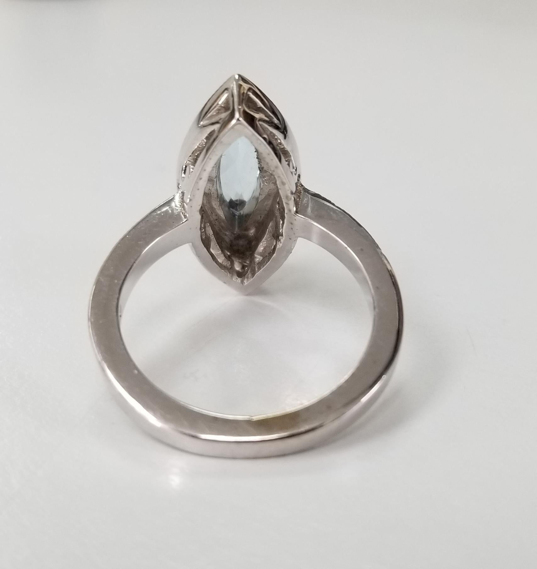 Artisan 14 Karat White Gold Blue Topaz Marquise Cut and Diamond Ring For Sale
