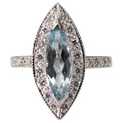 Retro 14 Karat White Gold Blue Topaz Marquise Cut and Diamond Ring
