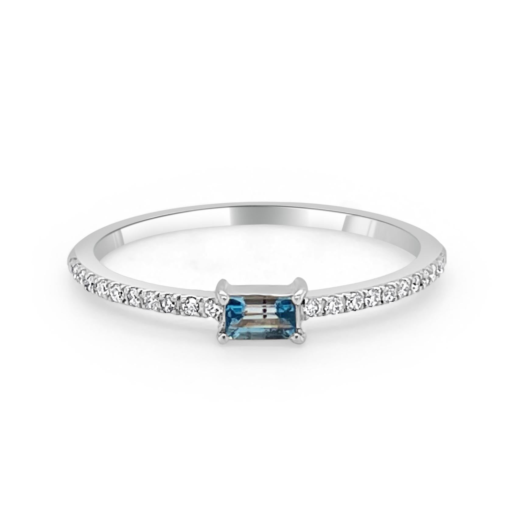 Charming and Elusive Design - This stackable ring features a 14k gold band, a baguette shaped gorgeous blue topaz approximately 0.16 ct, and round diamonds approximately 0.09 ct. 
Measurements for ring size: The finger Size of the ring is 6.5 and