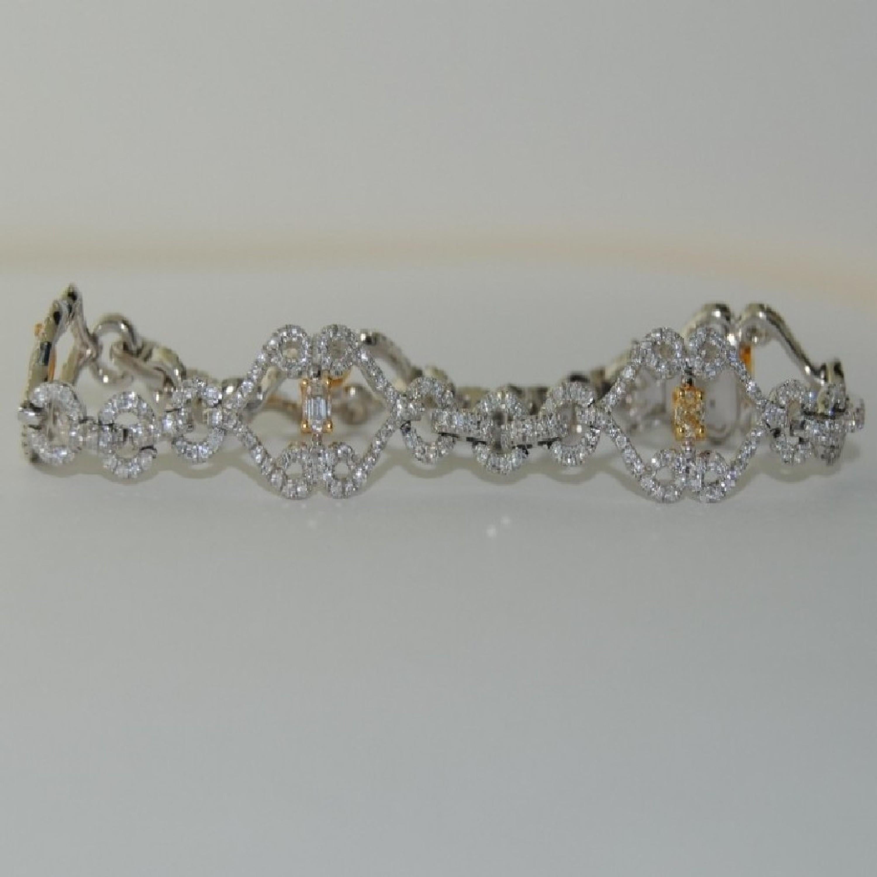 This 14-karat White Gold Bracelet has 433 Round Diamonds that weigh 1.93 carats and 5  Fancy Diamonds/Yellow that weigh 1.21 carats. The cut of the Yellow Diamonds are Oval, Emerald, and Pear.
Size is 7 inches
New Bracelet