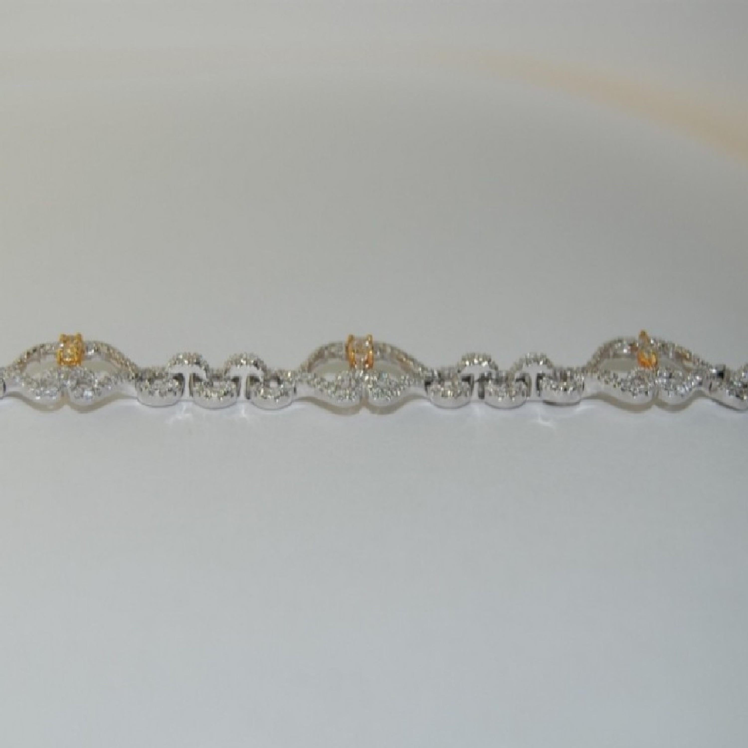 Oval Cut 14 Karat White Gold Bracelet with White and Fancy Diamond/Yellow For Sale