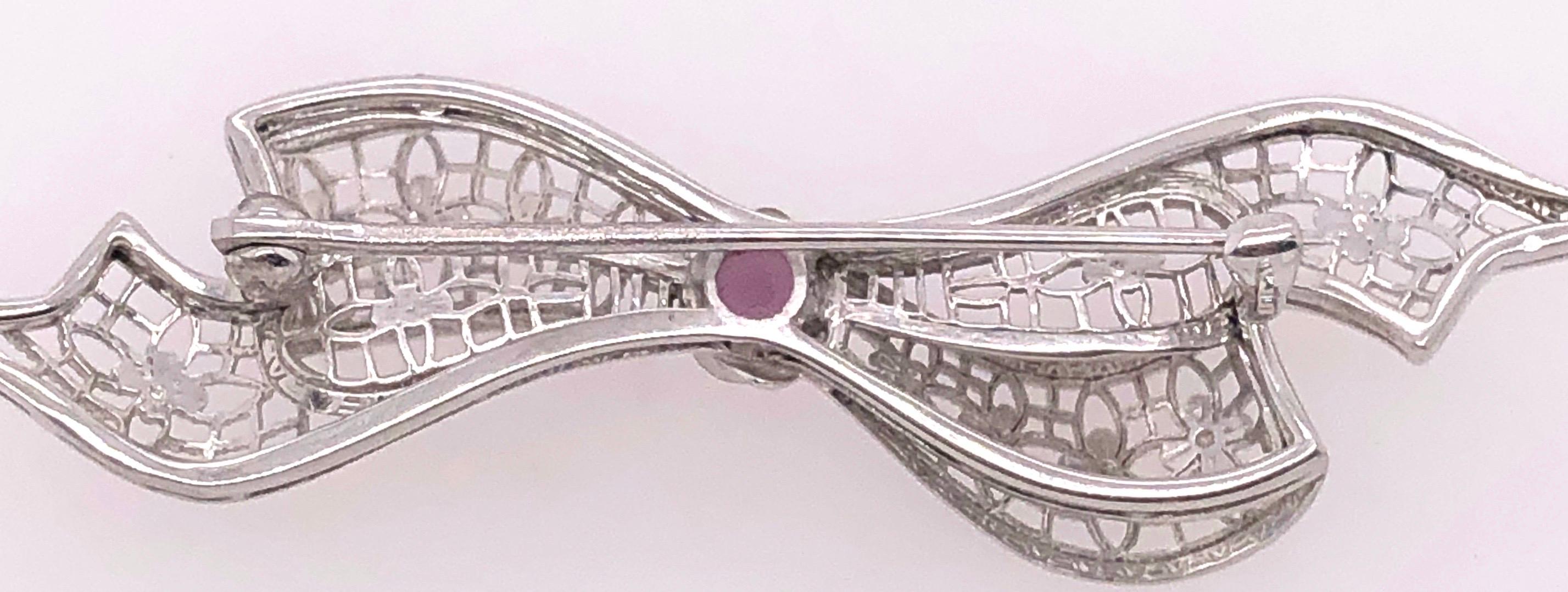 14 Karat White Gold Brooch Filigree Bow Design With Amethyst Center Stone Pin.
3.30 grams total weight.