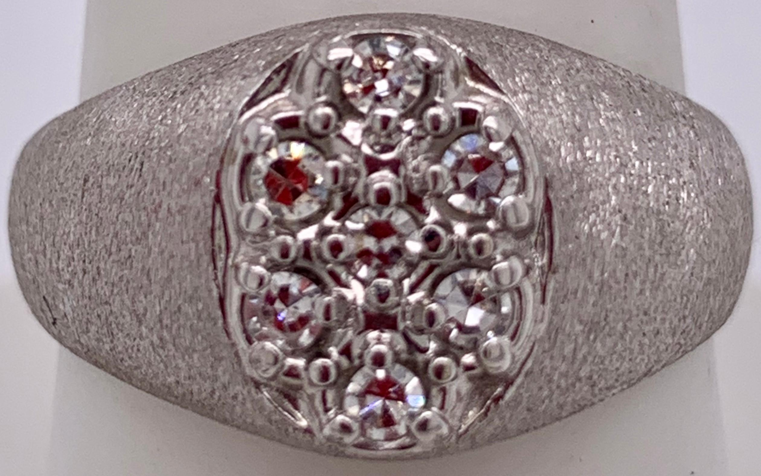 14Kt White Gold Brushed Finish With Diamond Cluster Fashion Ring.
Size 7.34.  
1.50 Total diamond weight.  
12.21 gram total weight.