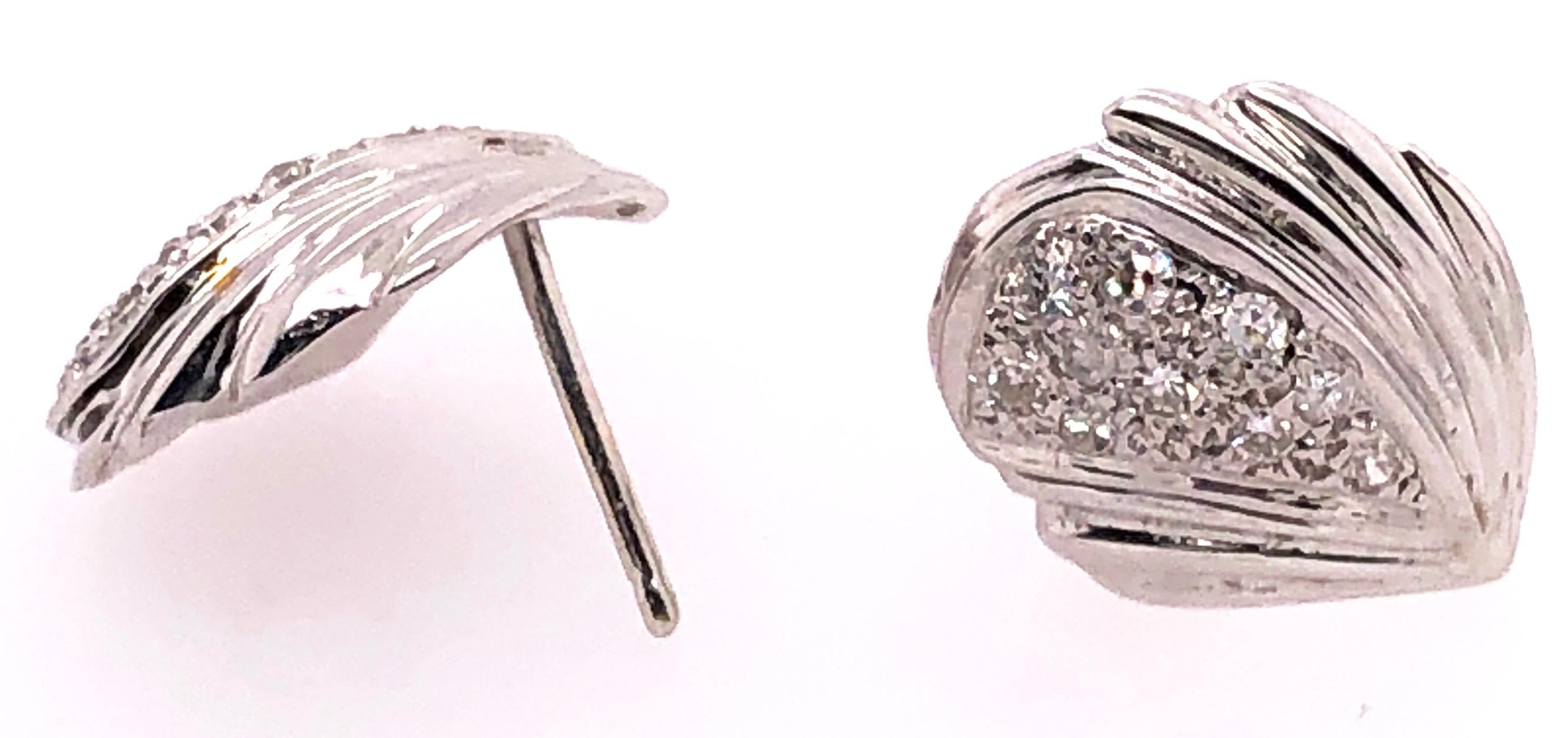 14 Karat White Gold Button Earrings with Diamonds 0.50 Total Diamond Weight.
4.38 grams total weight.