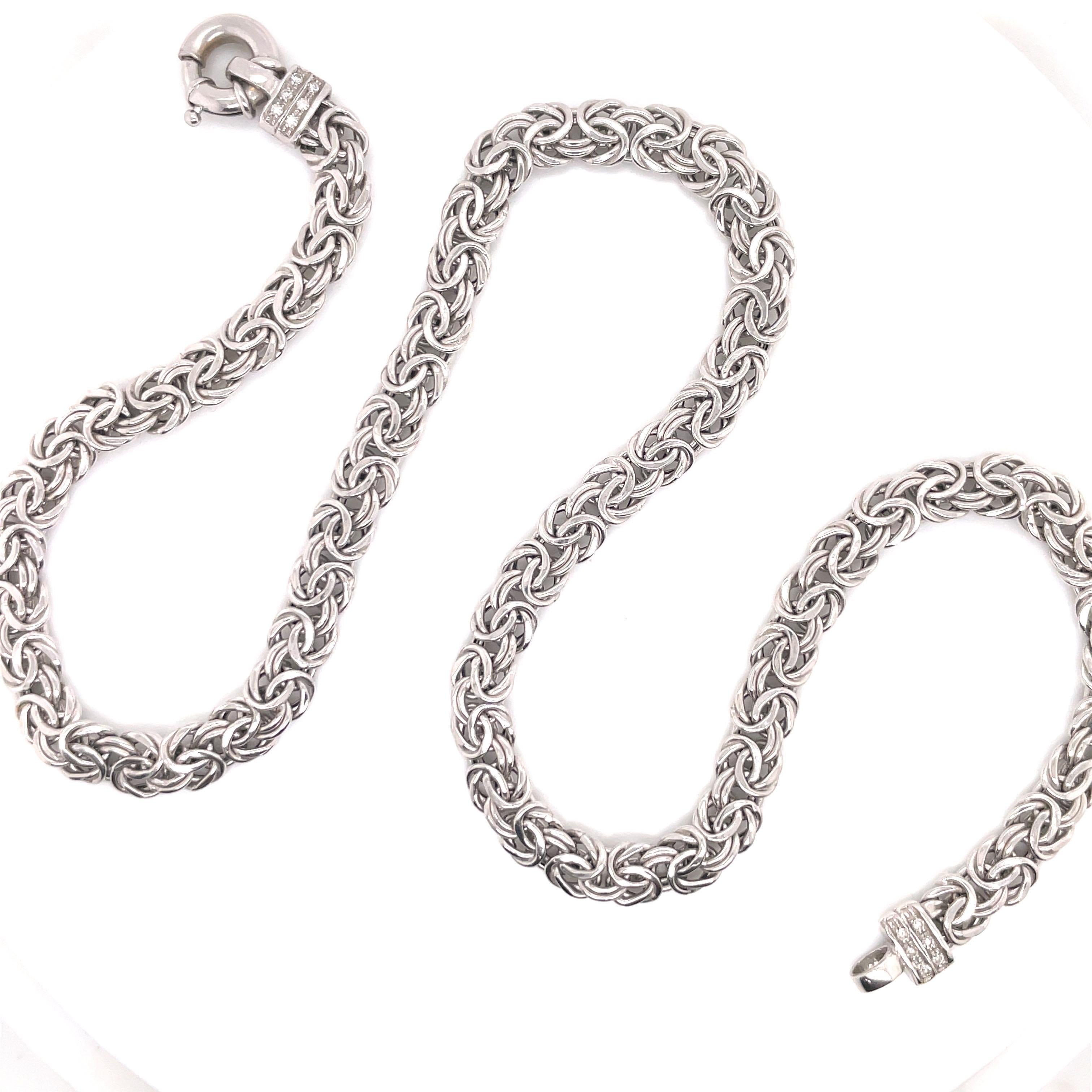 14 Karat White Gold necklace featuring a Byzantine motif link weighing 17.8 grams, 18 inches. 
Made in Italy