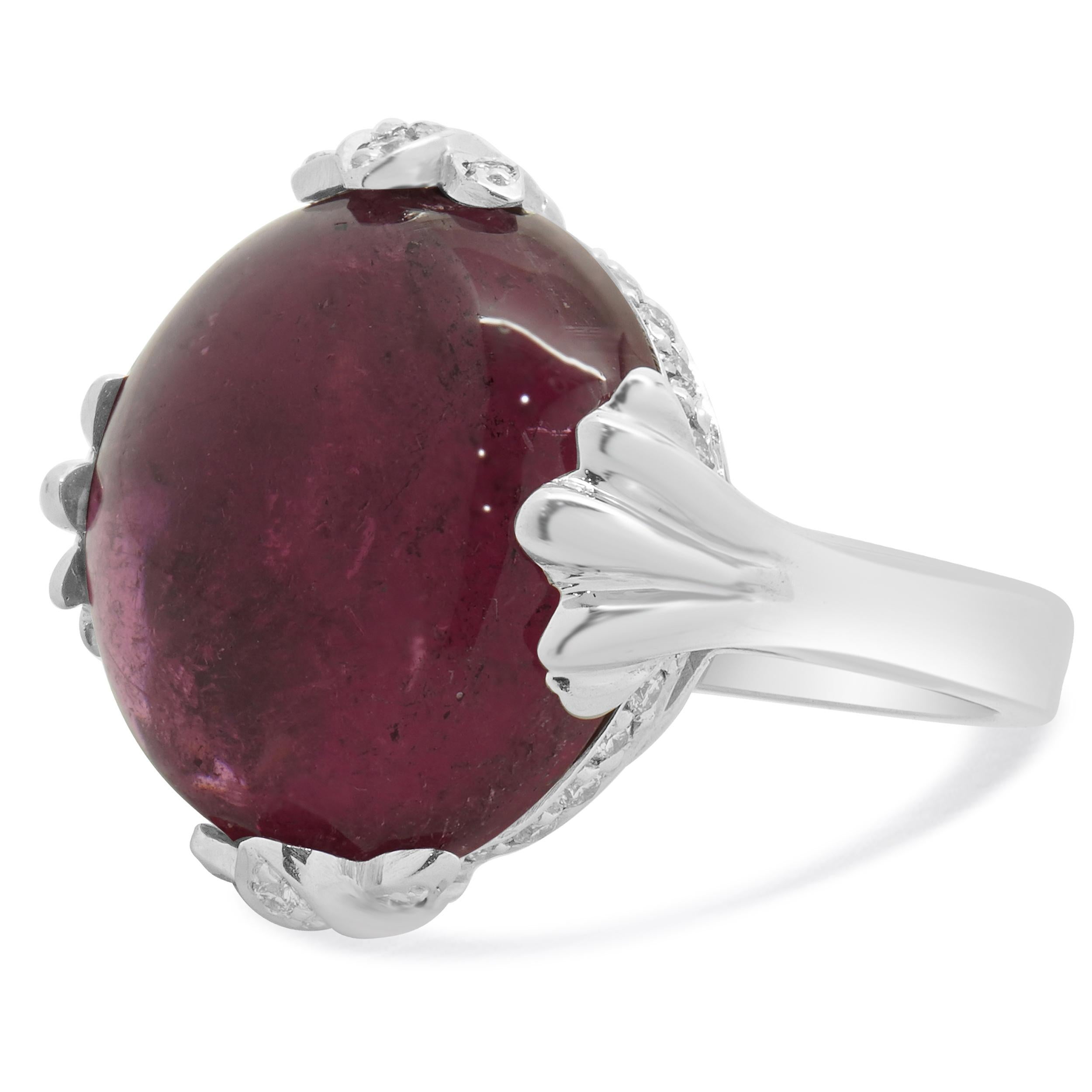 Designer: custom design
Material: 14K white gold
Diamonds: 30 round cut = 0.40cttw
Color: H
Clarity: SI2
Pink Tourmaline: 1 cabochon cut = 19.60cttw
Dimensions: ring top measures 20.3mm long
Ring Size: 7.25 (please allow two extra shipping days for