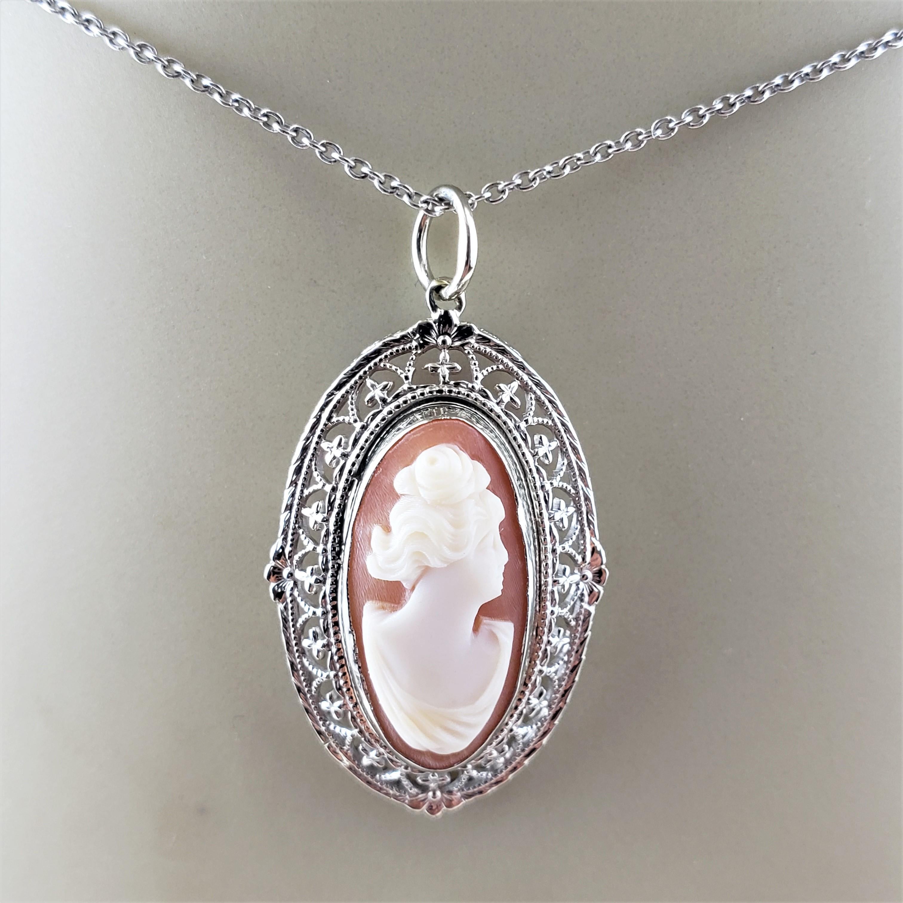 14 Karat White Gold Cameo Pendant-

This elegant cameo features a lovely lady in profile framed in beautifully detailed 14K white gold filigree.

*Chain not included

Size:  28 mm x 17 mm

Weight:  1.5 dwt. /  2.4 gr.

Acid tested for 14K