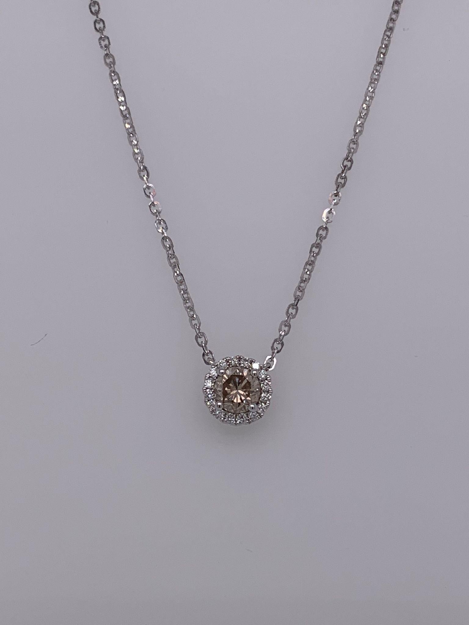 Champagne Diamond weighing .55 cts
Diamonds weighing .10 cts
set in 14K white gold
