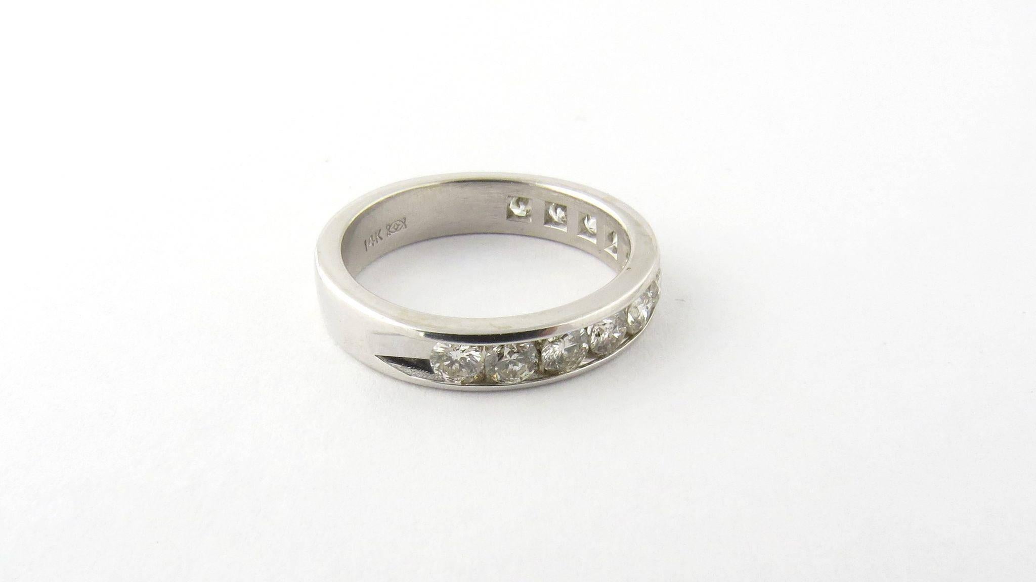 Vintage 14K White Gold Channel Set Diamond Band Size 5.75 

This ring is channel set with 11 round brilliant diamonds. Each diamond is approximately .08 carats for a total carat weight of .88 cts. Diamonds are J color and SI clarity. 

The shank