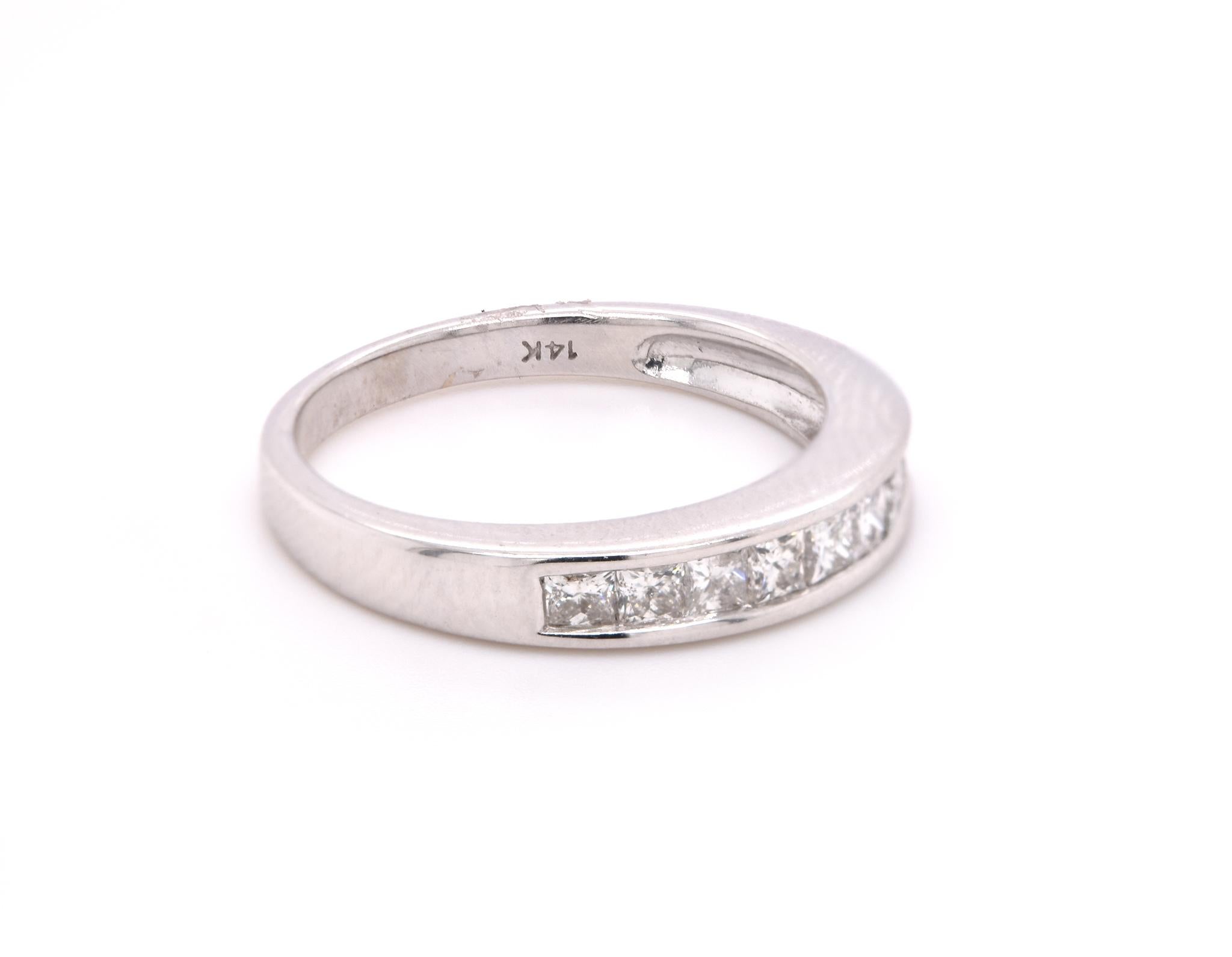 
Designer: custom design
Material: 14k white gold
Diamonds: 9 princess cut = .65cttw
Color: H
Clarity: SI1
Ring size: 6
Weight: 3.03 grams 
