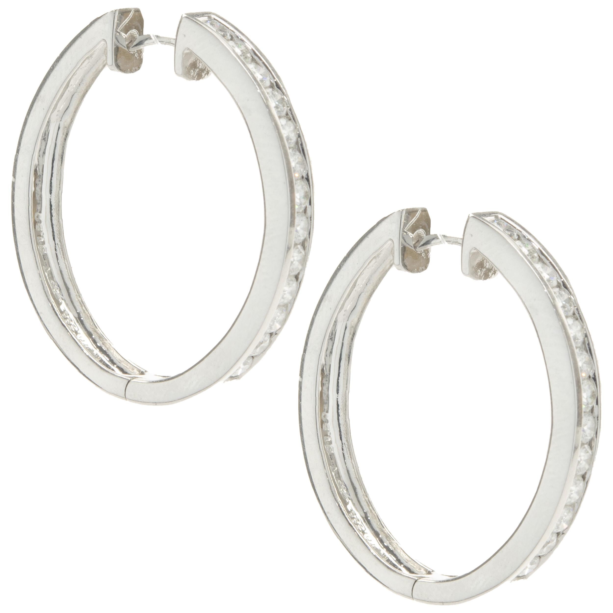 Designer: custom design
Material: 14K white gold
Diamonds: 26 round brilliant cut= 1.50cttw
Color: G
Clarity: SI1
Dimensions: earrings measure 32mm long
Weight: 13.59 grams