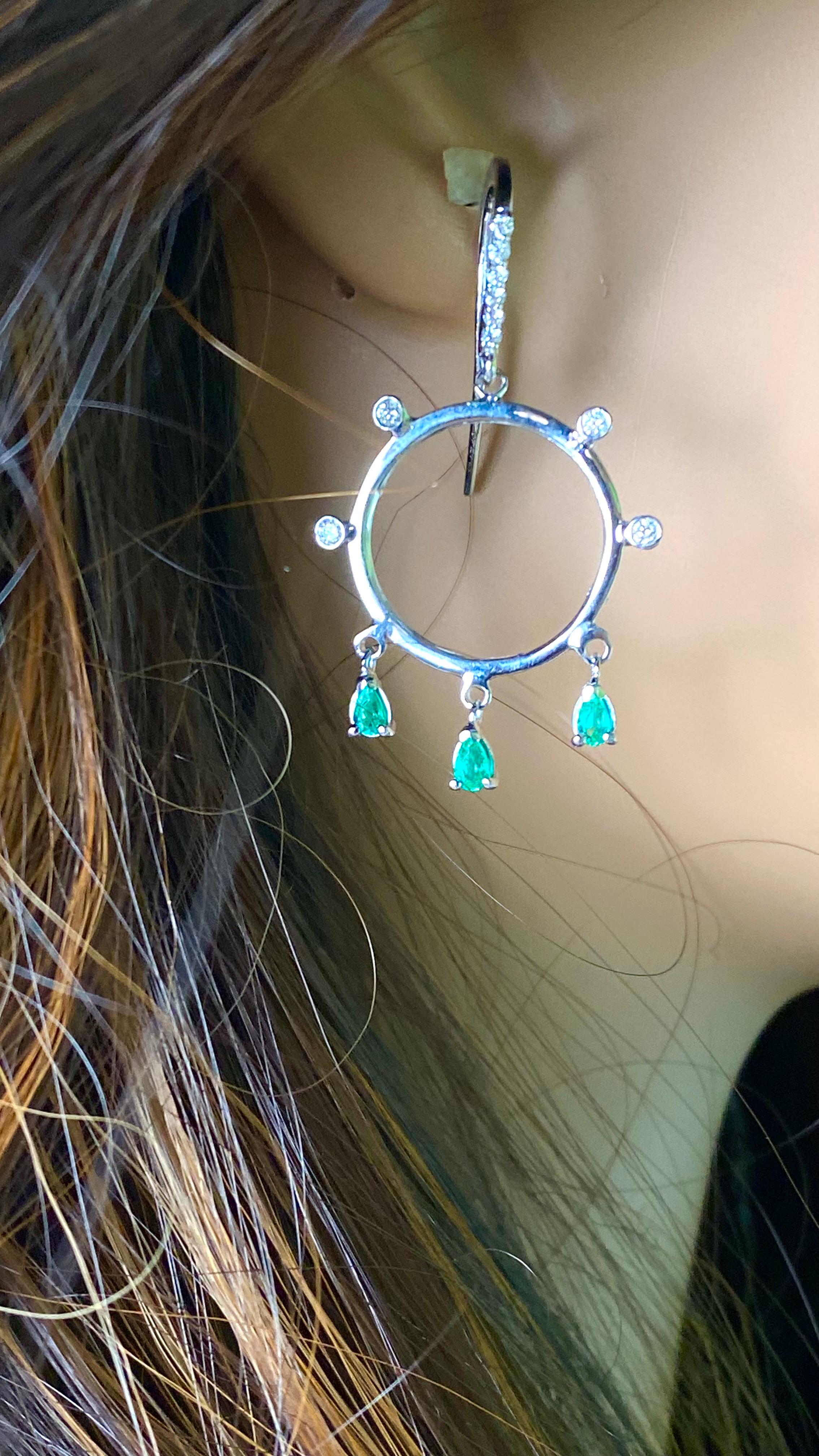Women's 14 Karat White Gold Circle Hoop 1.65 Inch Earrings with Emeralds and Diamonds For Sale