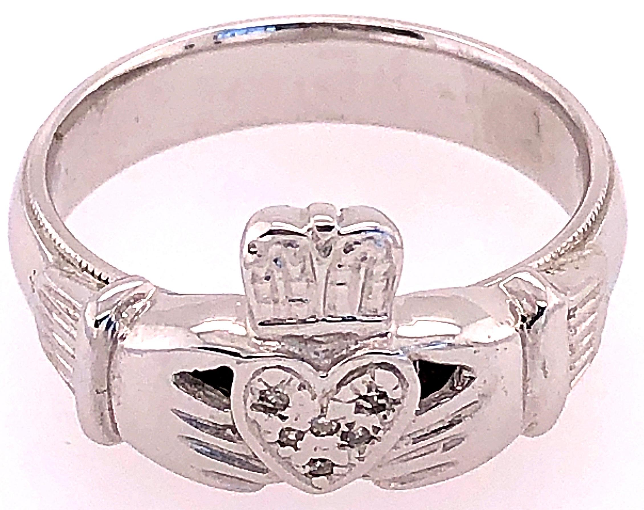14 Karat White Gold Claddagh Ring with Round Diamonds.
Claddagh ring is a traditional Irish ring which represent love, loyalty, and friendship (the hand represent the friendship, the heart represents love and the crown represent loyalty).
The ring,
