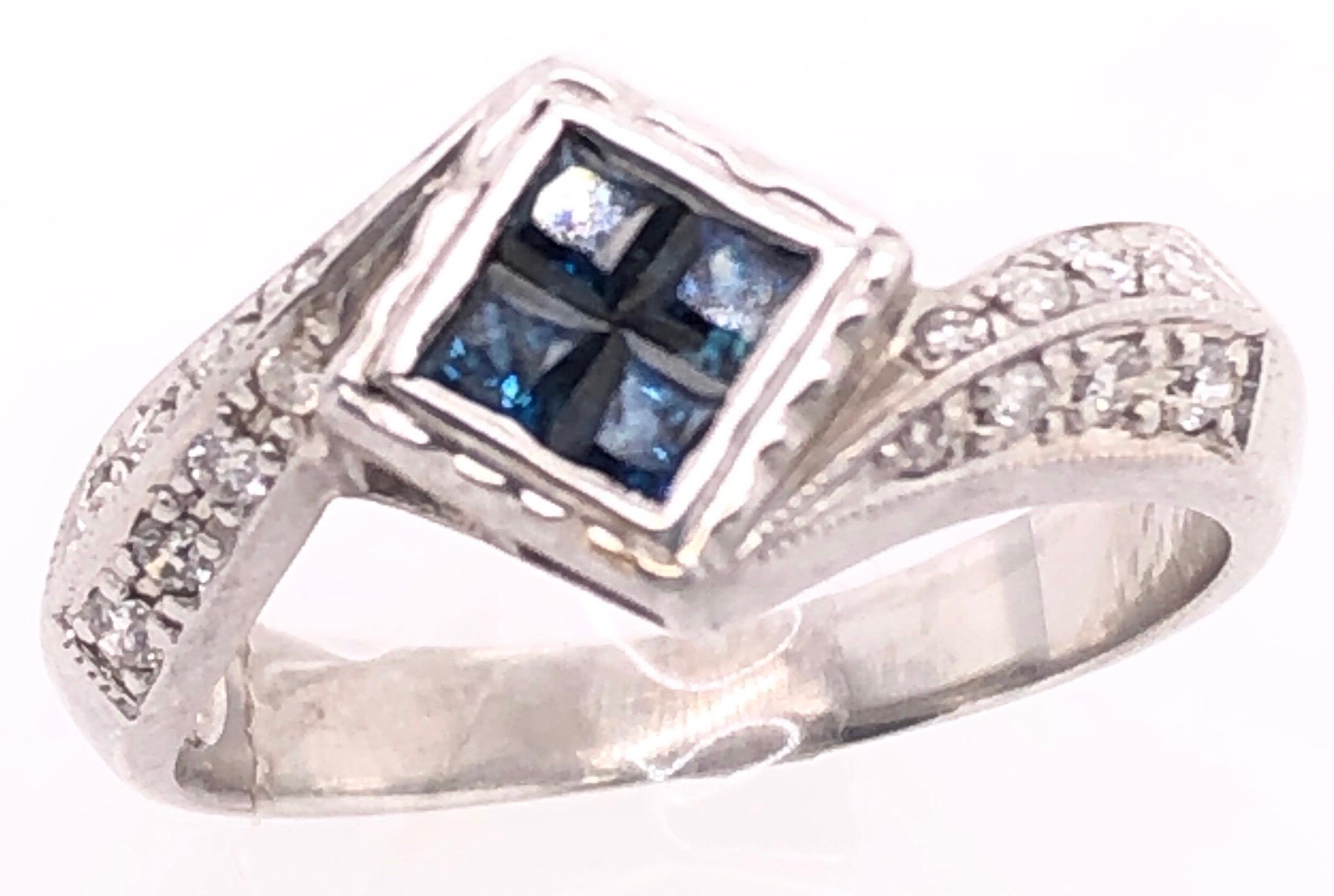 14 Karat White Gold Contemporary Sapphire Ring with Round Diamonds 
0.16 TDW .
Size 7.5
4.46 grams  total weight.