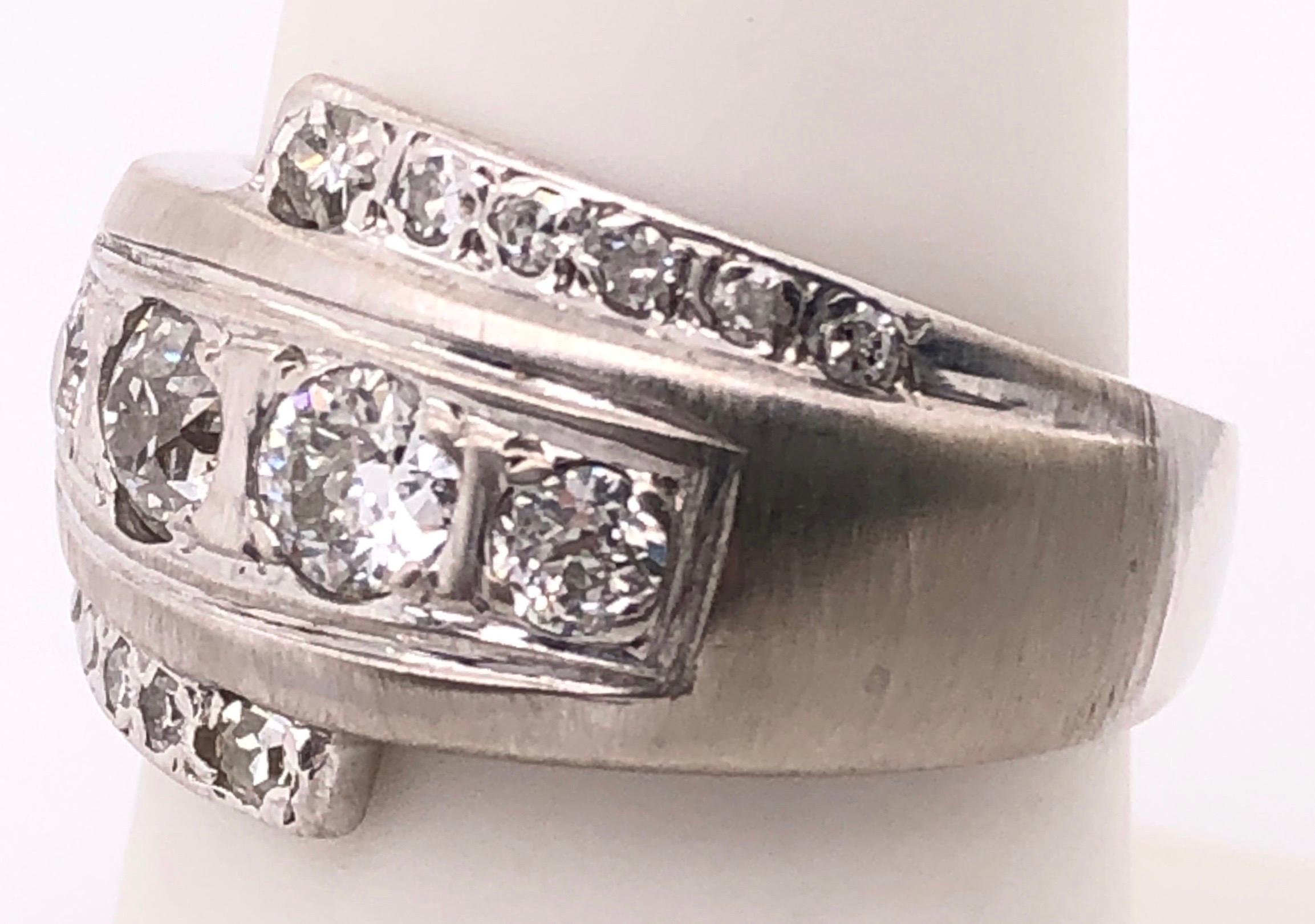 14 Karat White Gold Contemporary Ring with Round Diamonds 2.00 Total Diamond Weight.
Size 7.25
6.17 grams total weight.

