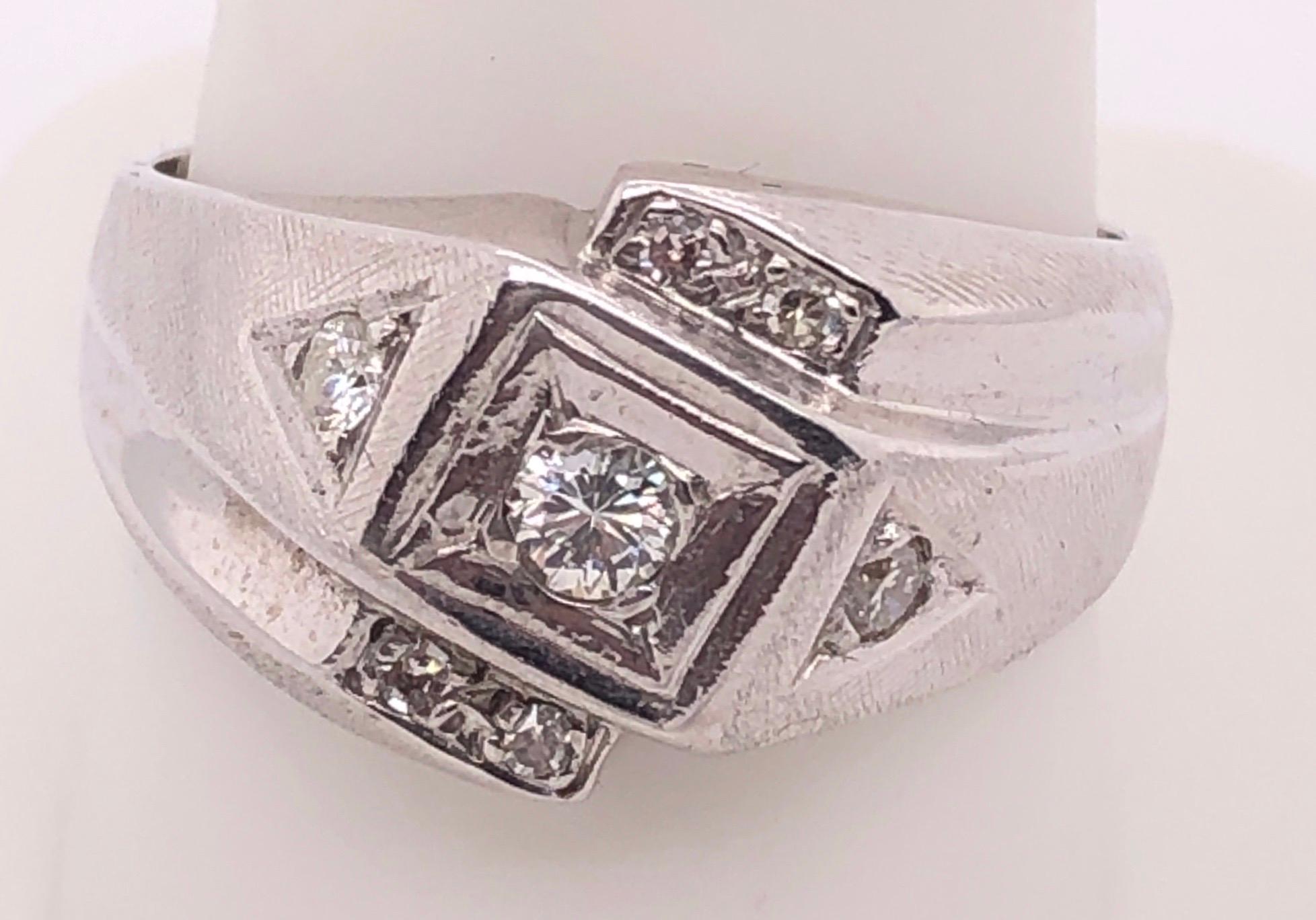 14 Karat White Gold Contemporary Diamond Solitaire with Diamond Accents Ring
0.75 total diamond weight
Size 10.5
8.41 grams total weight.