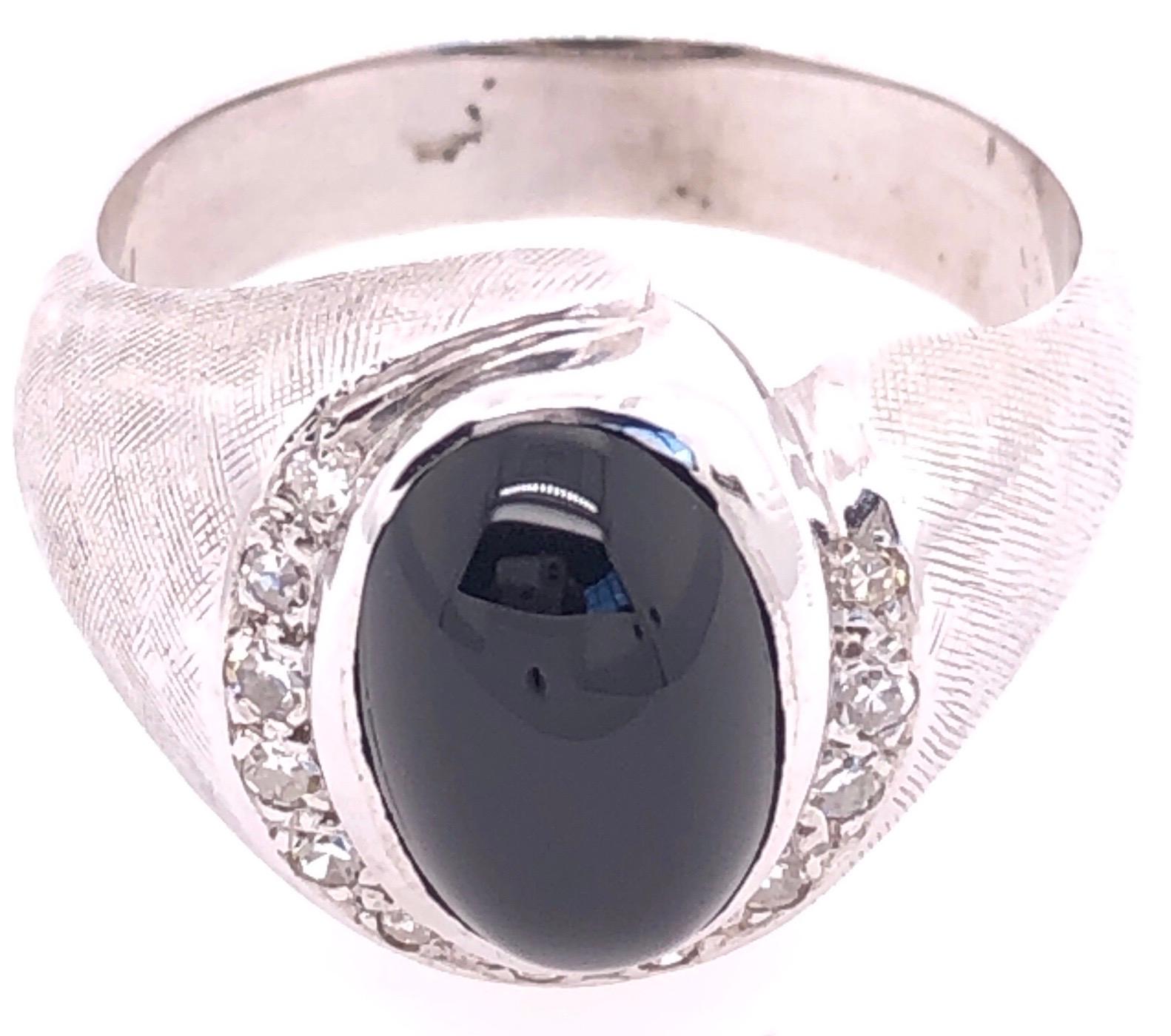 14 Karat White Gold  Contemporary Onyx Ring with Diamonds.
0.36 total diamond weight.
9.00 mm x 12.00 mm black onyx
Size 10
10.06 grams total weight.

*This ring can be resized at your local jeweler if need.