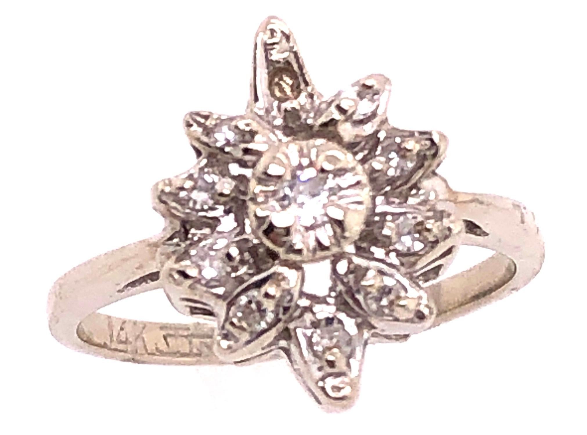 14 Karat White Gold Contemporary Ring with Diamonds 0.33 Total Diamond Weight.
Size 5.75
3.29 grams total weight.