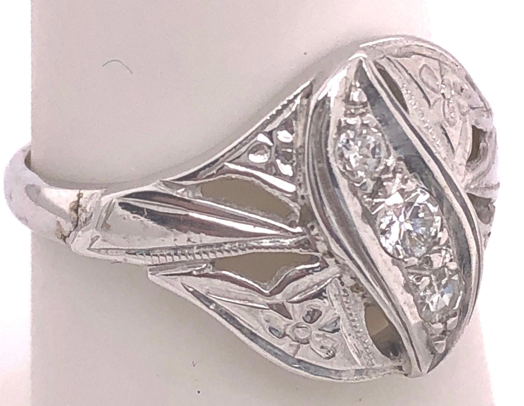 14 Karat White Gold Contemporary Ring with Three Round Diamonds Size 5.75.
0.25 total diamond weight.
2.85 grams total weight.