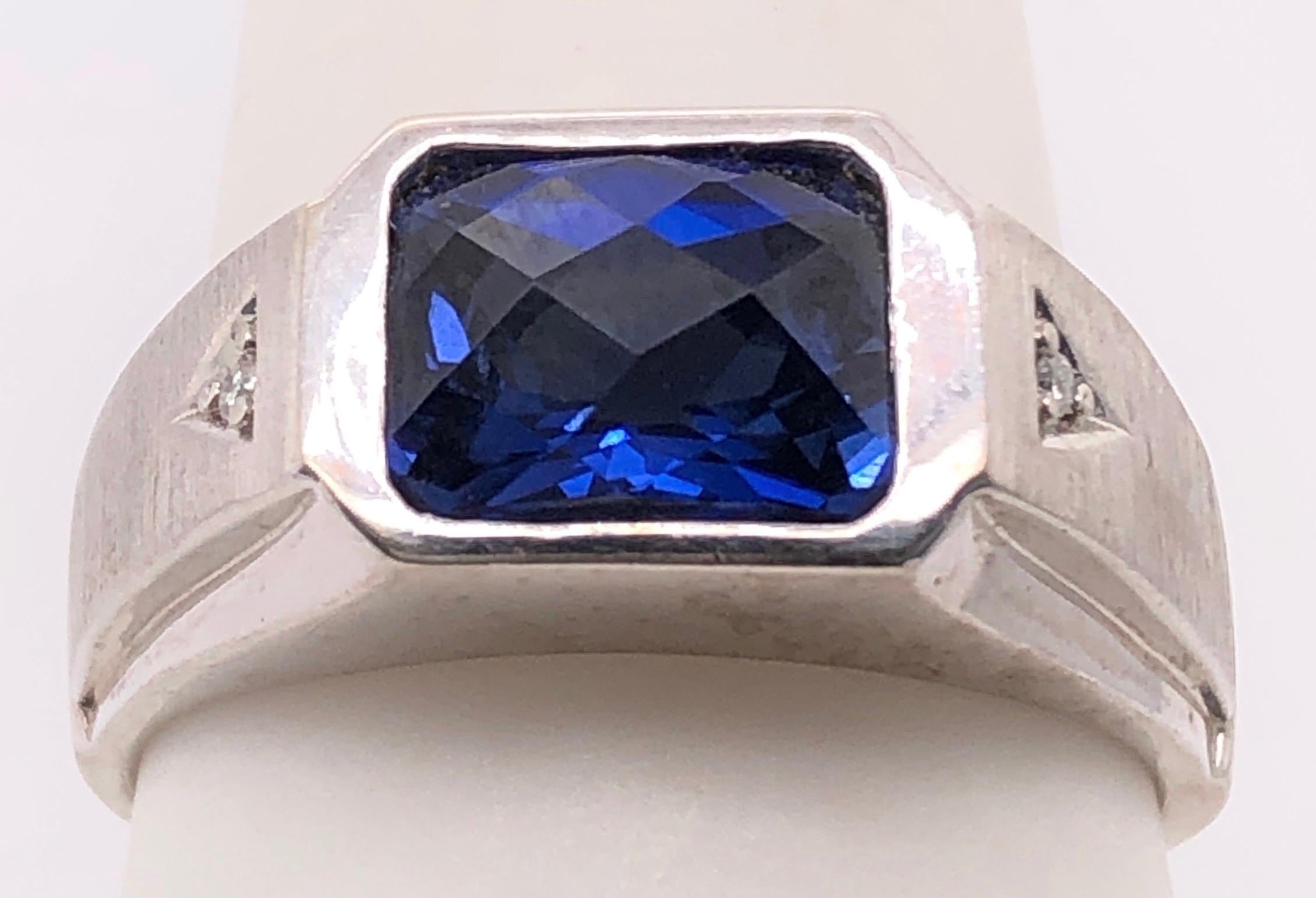14 Karat White Gold Contemporary Sapphire Ring with Diamonds 0.05 TDW.
Size 10
8.90 grams total weight.