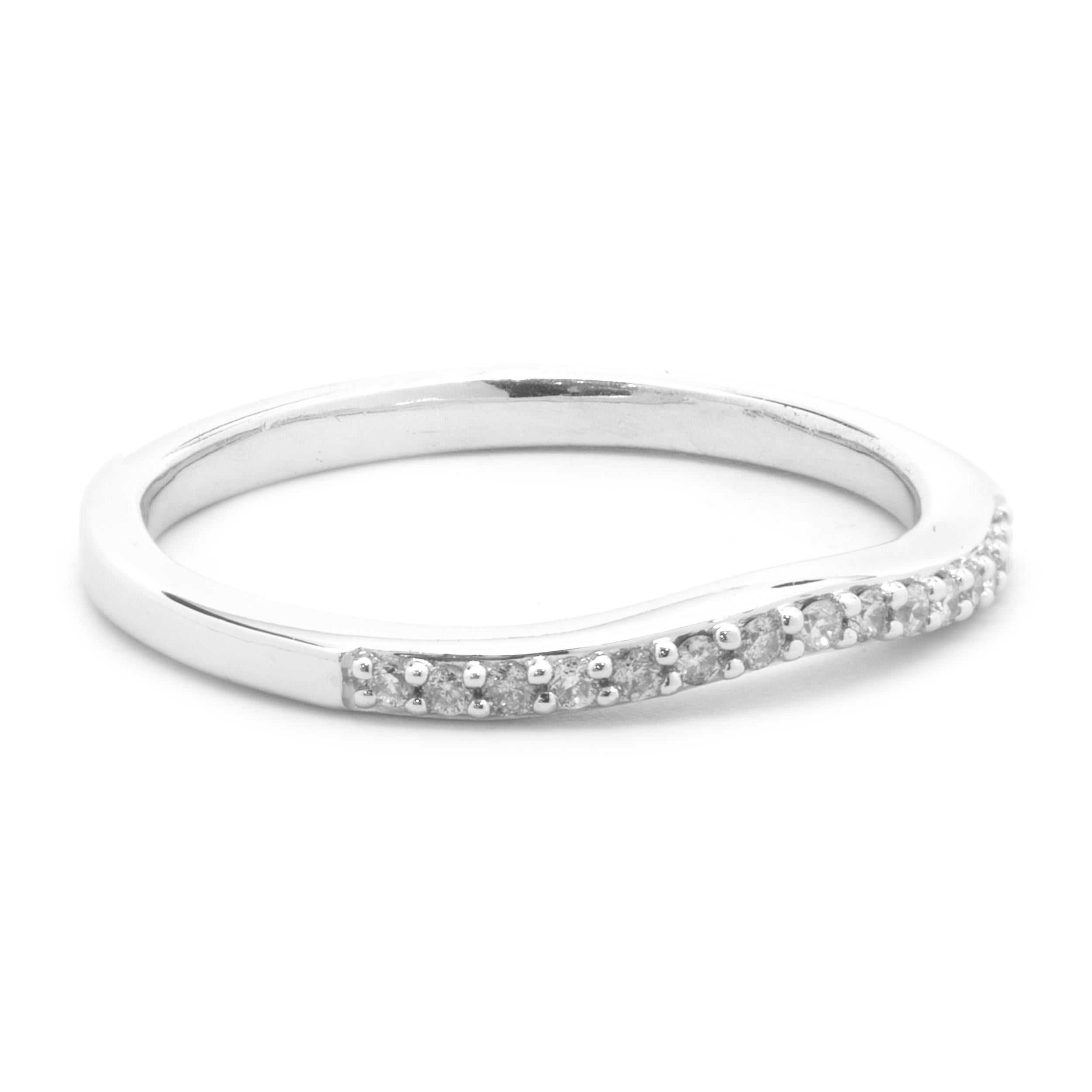 Designer: Custom
Material: 14K white gold
Diamonds: 16 round cut = .16cttw
Color: H
Clarity: SI2
Size: 7 (please allow for two additional days for complimentary sizing)
Dimensions: ring measures 2mm in width
Weight: 1.99 grams
