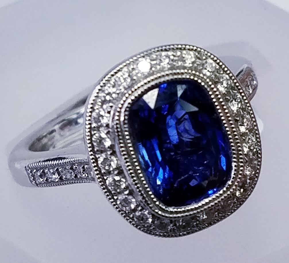 14 Karat White Gold Cushion Cut Blue Sapphire and Diamond Ring
2.07 Carats of Sapphires 
0.35 Carats of Diamonds
Cushion Cut
14 Karat White Gold