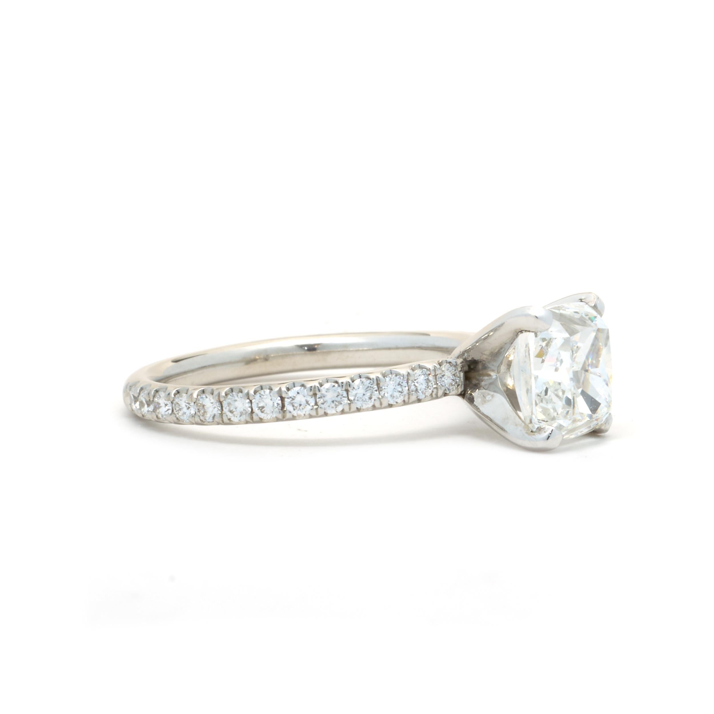 Designer: custom
Material: 14K white gold
Diamond: 1 cushion cut = 2.01ct 
Color: G
Clarity: VVS1
GIA 2151456249
Diamond: 26 round cut = .52cttw
Color: G
Clarity: VS1
Ring Size: 6.75 (please allow up to 2 additional business days for sizing