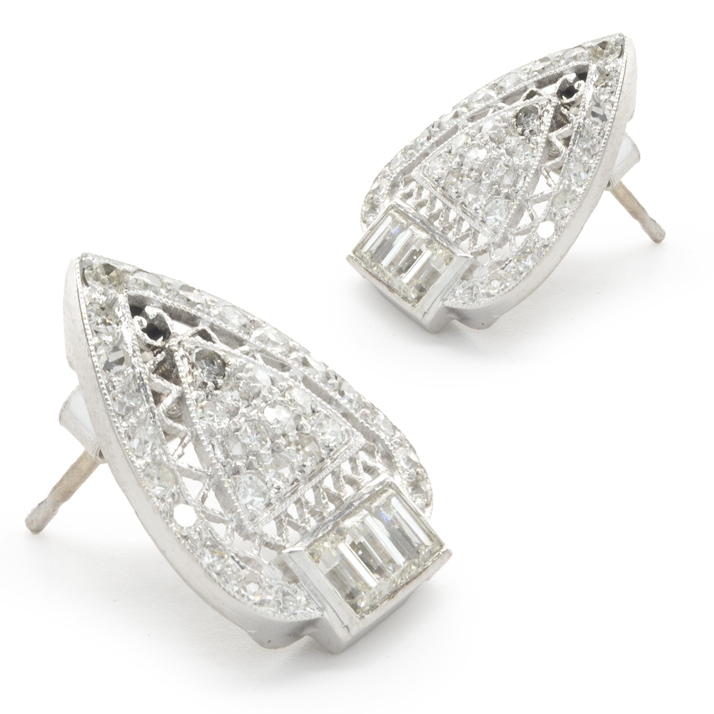 Designer: custom design
Material: 14K white gold
Diamonds: round brilliant and baguette cut= 0.50cttw
Color: G 
Clarity:SI1
Dimensions: earrings measure 15.5mm long
Weight: 3.43 grams
