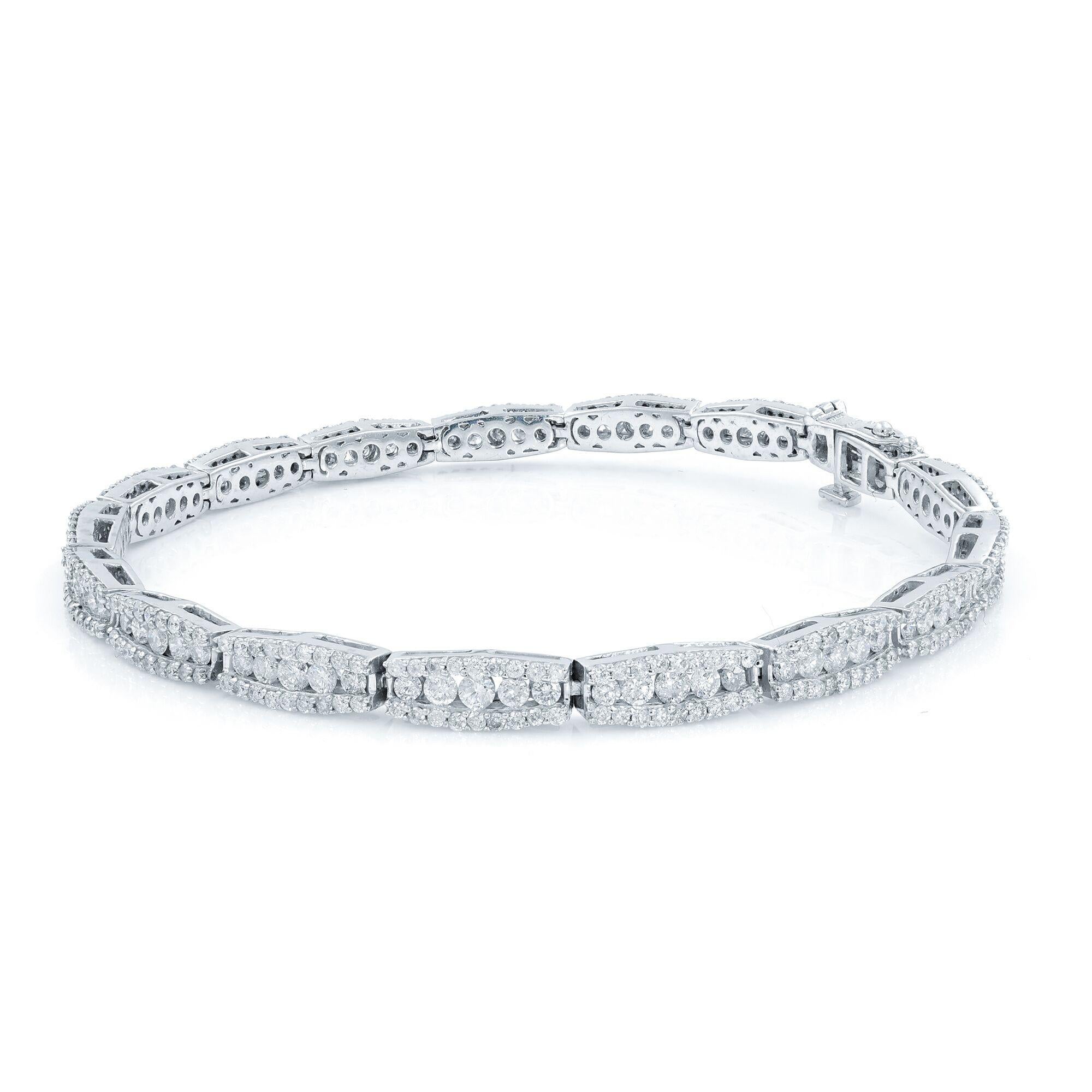 This chic and shining bracelet crafted in 14k white gold. A truly exemplary and elaborately rendered original Art Deco treasure. 3.5 inch wide by 7.5 inches in length. Total carat weight: 3.60.