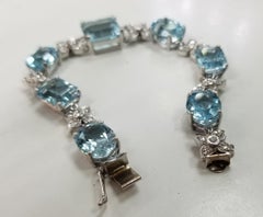 Bracciale in oro bianco 14 carati con diamanti e topazio azzurro