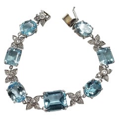 14 Karat White Gold Diamond and Blue Topaz Bracelet